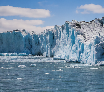 Large glacier face meeting open water, used to illustrate the power and scale of moving glacial ice.
